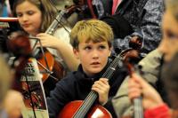 Photo of a boy in an orchestra