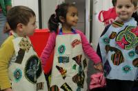 Photo of children in aprons