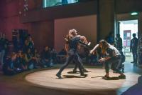 Photo of three young dancers in spotlight