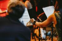 Orchestra musicians turn the page