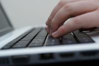 Photo of fingers on a keyboard