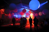 Photo of balloons in dark room