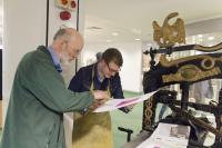 Photo of artist and printing press