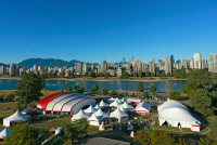 Photo of marquees on coast with blue sky