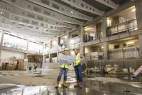 Photo of two men in building under construction