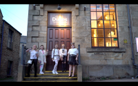 Five young Traveller girls outside the front door of the dukes lancaster