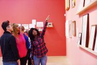 People looking at exhibits in a gallery