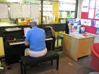 Image of pianist in library