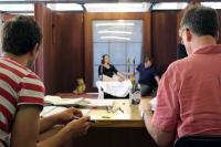 Photo of two men taking notes during opera rehearsal