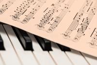 Image of piano keys and music