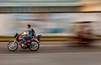 Photo of a motorcycle overtaking a bike