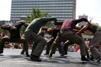 Photo of men dancing in city square