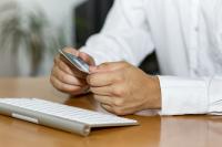 Man with keyboard and credit card