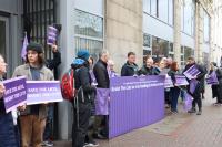 Equity members protesting in with banners saying 'Resist the cuts'