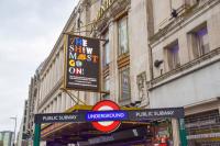 London tube station with Show Must Go On poster above