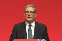 Kier Starmer speaks at a podium at the Labour Party confrence