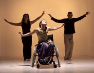 Photo of three dancers - one in a wheelchair