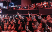 a crowd of people watch a performance