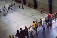 Photo of people on balcony in a gallery