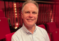 David manning sits in a theatre auditorium