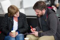 Photo of researcher talking to member of the public