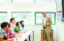 Photo of man lecturing to students