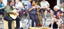 Photo of musicians playing on the street