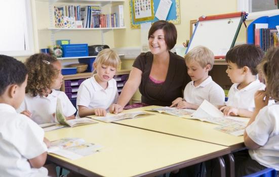 Photo of teacher and pupils