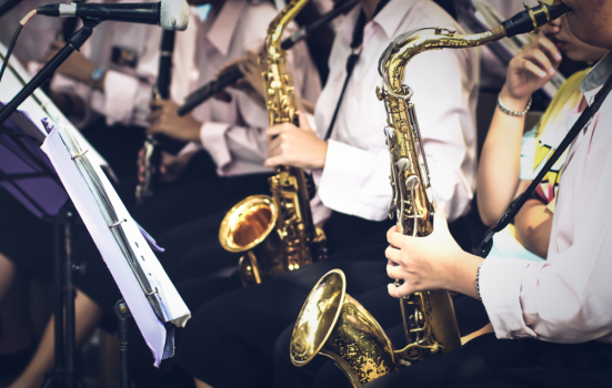 brass players play musical instrument