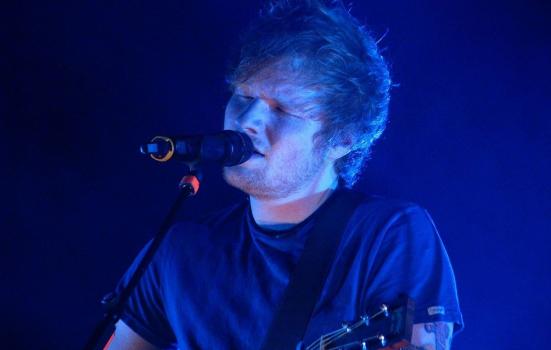 Ed Sheeran performing on stage