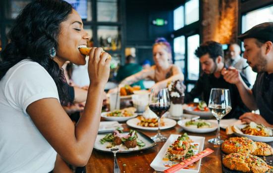 Photo of people eating at restaurant