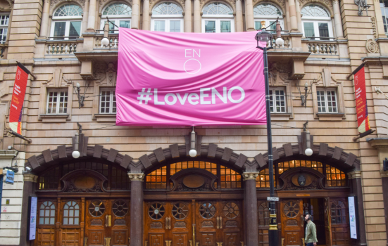 exterior of London Coliseum Theatre with pink banner reading #LoveENO