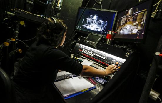 Someone operating a lighting board at the mercury theatre