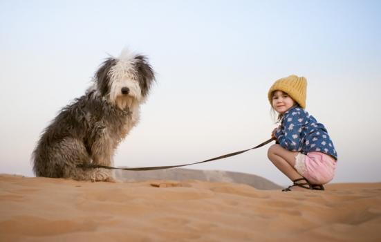 Photo of a girl and a dog