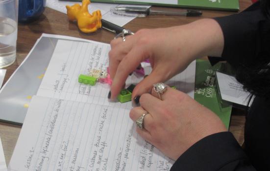 Photo of person playing with Lego