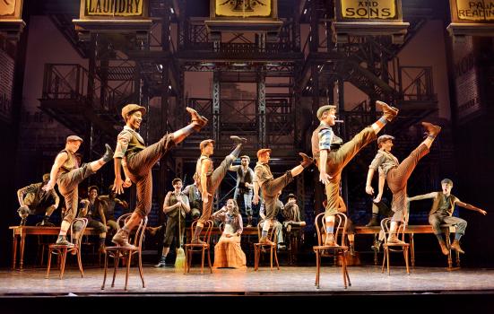 Production shot of dancers in Disney’s Newsies