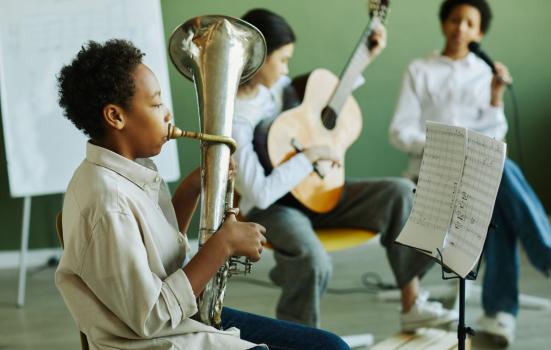 Schoolchildren playing musical instruments