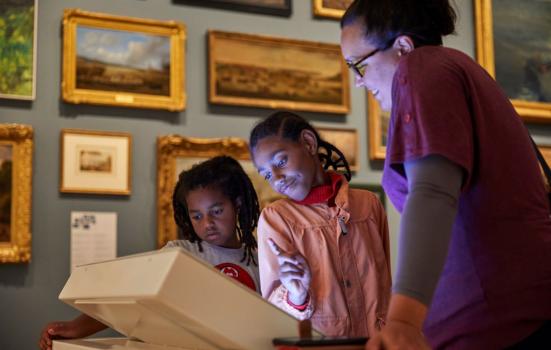 Children viewing an exhibit in a museum