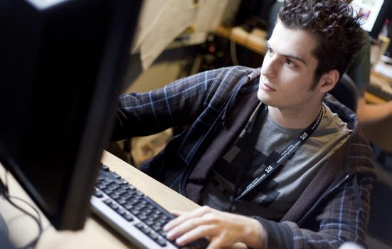 A man sitting at a computer