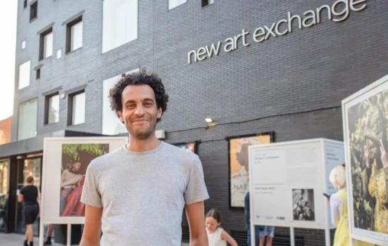 Saad Eddine Said, CEO and Artistic Director of New Art Exchange, standing outside the building