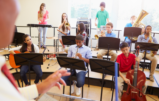 Pupils Playing Musical Instruments In School Orchestra