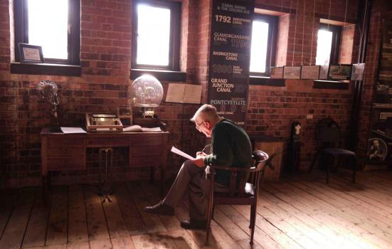 Photo of volunteer in museum