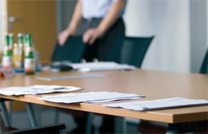 A table with documents laying on it.