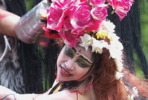 woman wit flower hat and colourful clothing