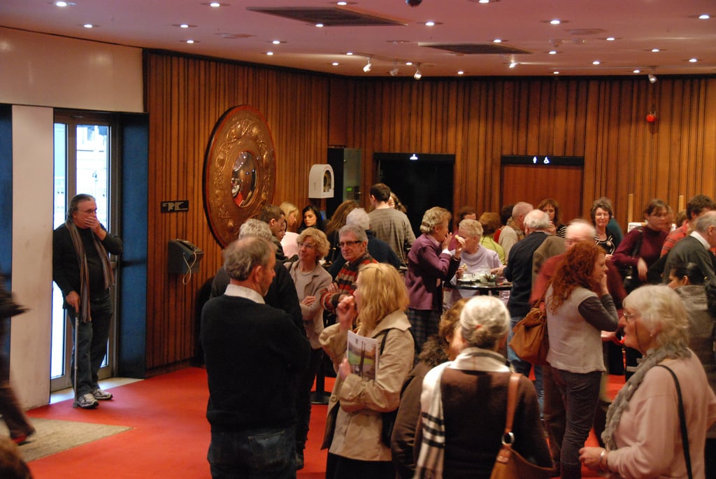 Photo of people in theatre lobby