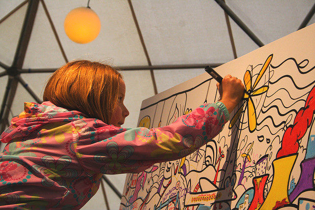 Photo of a young girl drawing