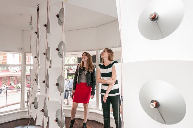 Photo of people viewing a sound art installation