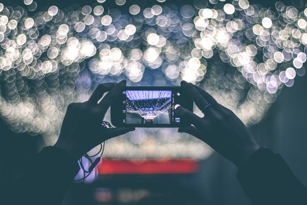 Photo of someone taking a picture with a smartphone