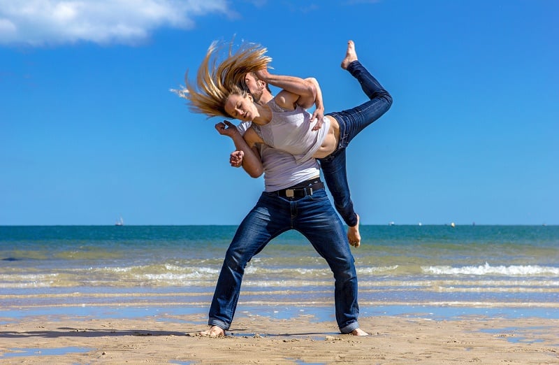 Man and woman dancing on the beach 