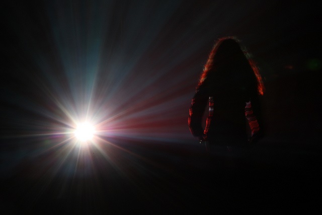 Photo of person in spotlight